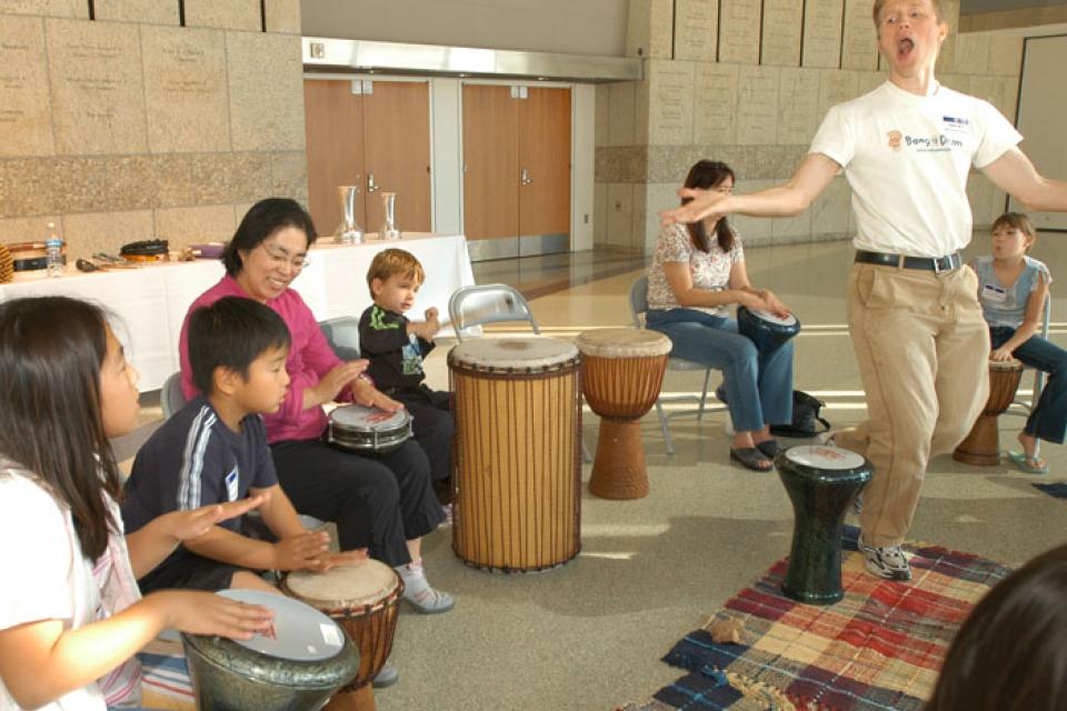 Chris Reid leads a kids drum workshop